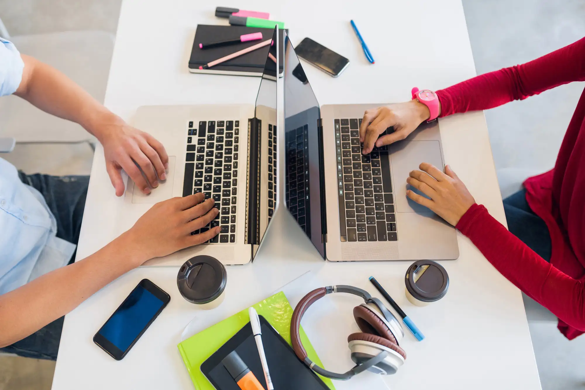 view-from-avove-hands-young-man-woman-working-laptop-co-working-office-ezgif.com-optiwebp